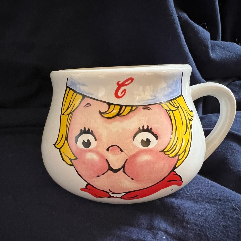 Campbells soup mug/soup bowl with blond child.  Front with face, back with hair.